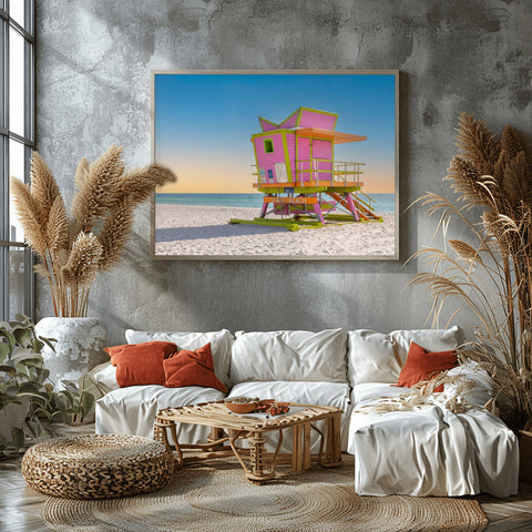 The 46th Street lifeguard tower in Miami Beach at sunrise, with golden light hitting the structure and soft blue sky.