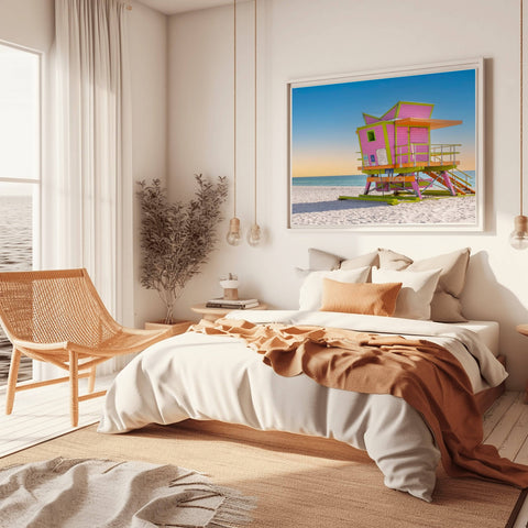 The 46th Street lifeguard tower in Miami Beach at sunrise, with golden light hitting the structure and soft blue sky.