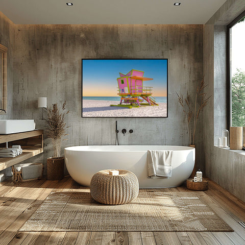 The 46th Street lifeguard tower in Miami Beach at sunrise, with golden light hitting the structure and soft blue sky.