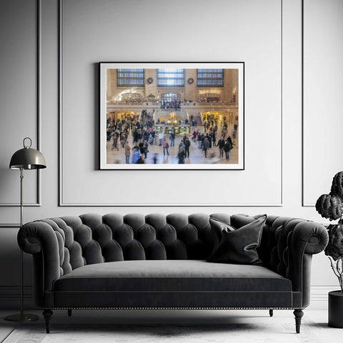 High-angle photograph of the Main Concourse in Grand Central Terminal, featuring the opal-faced gold clock and blurred commuters in motion by Richard Silver.