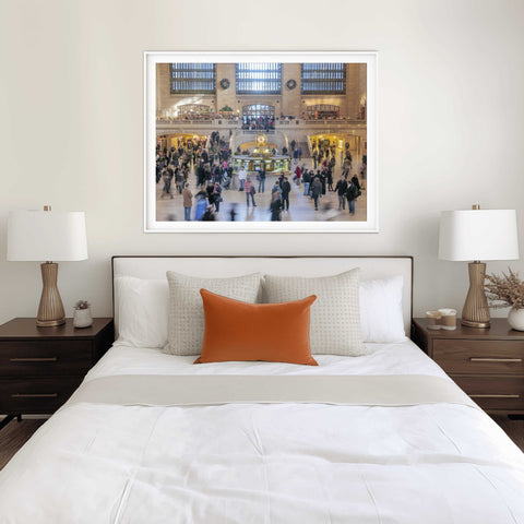 High-angle photograph of the Main Concourse in Grand Central Terminal, featuring the opal-faced gold clock and blurred commuters in motion by Richard Silver.