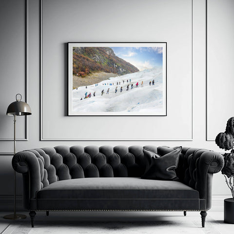 High-angle view of people ice trekking across the deep blue crevasses of the Perito Moreno Glacier in Argentina by Richard Silver.