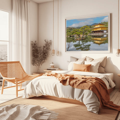 The top two floors of the Kinkaku-ji temple covered in gold leaf, reflecting perfectly in the Mirror Pond (Kyoko-chi) surrounded by traditional Japanese pines.