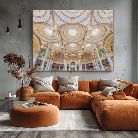Symmetrical architectural photography of the Salle Labrouste at the National Library of France in Paris, featuring sixteen slender iron columns and nine terra cotta domes.