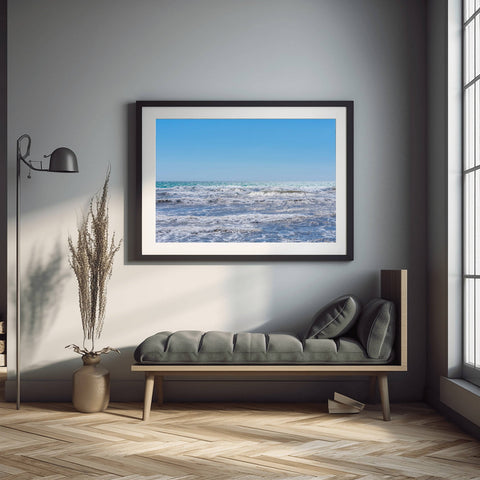 A minimalist horizon of the Balearic Sea in Mallorca, Spain, featuring vibrant blue water and a clear Mediterranean sky.