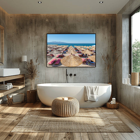 Rustic bamboo umbrellas on a pebbled beach in Sarande, Albania, overlooking the turquoise Ionian Sea.
