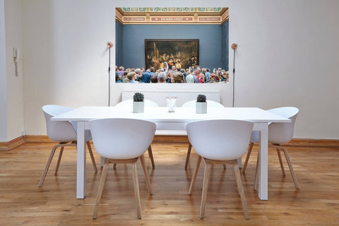 Interior photography of the Gallery of Honour at the Rijksmuseum in Amsterdam, featuring masterpieces by Rembrandt and other Dutch artists.