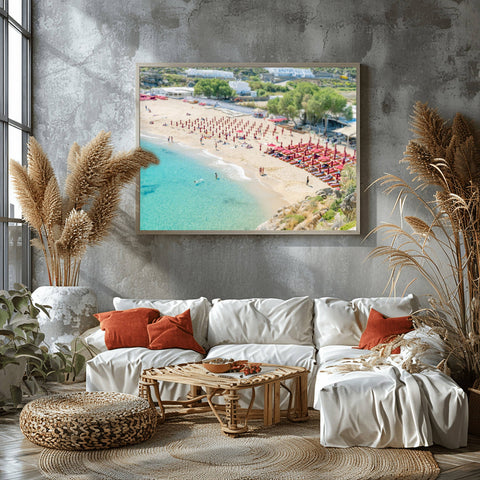 High-angle tilt shift view of Super Paradise Beach in Mykonos, featuring turquoise water and tiny-looking blue umbrellas.