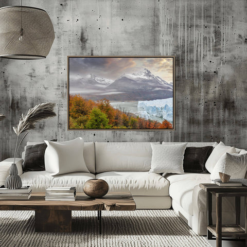Landscape view of the Perito Moreno Glacier in Argentina framed by trees and rugged mountain peaks by Richard Silver.
