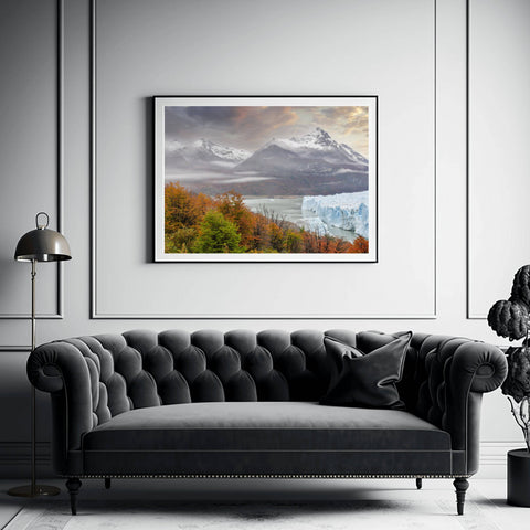 Landscape view of the Perito Moreno Glacier in Argentina framed by trees and rugged mountain peaks by Richard Silver.