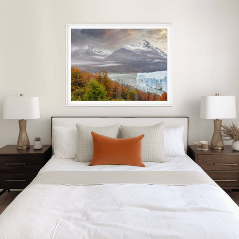 Landscape view of the Perito Moreno Glacier in Argentina framed by trees and rugged mountain peaks by Richard Silver.