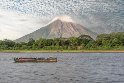 A boat in the lake on Ometepe Island with the Volcano Concepcion in the background