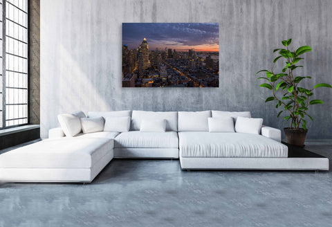 A rooftop sunset view of the West Side of Manhattan, looking toward the Hudson River and New Jersey.
