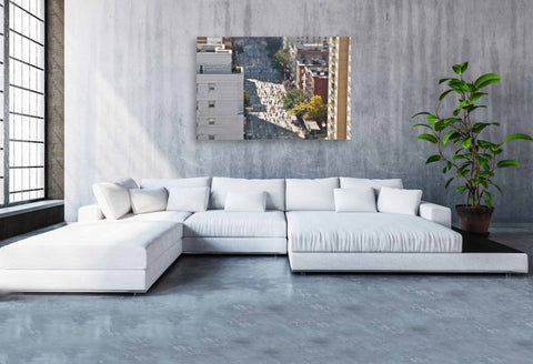 Tilt shift photography of the New York City Marathon, showing thousands of tiny-looking runners passing through the city streets