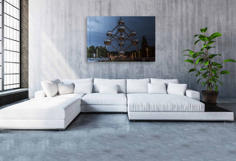 A Time Slice photograph of the Atomium in Brussels, Belgium, showing the transition from daylight to evening across its metallic spheres.